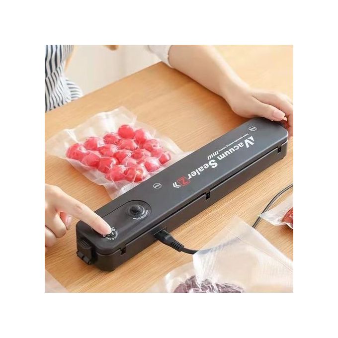 Machine à emballer sous vide pour alimentation